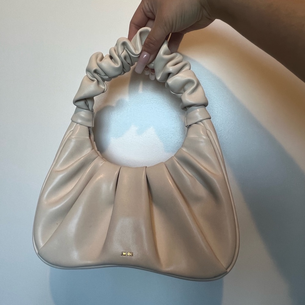 Small white handbag.